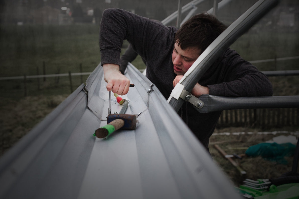 Fitting the polytunnel frame by hand
